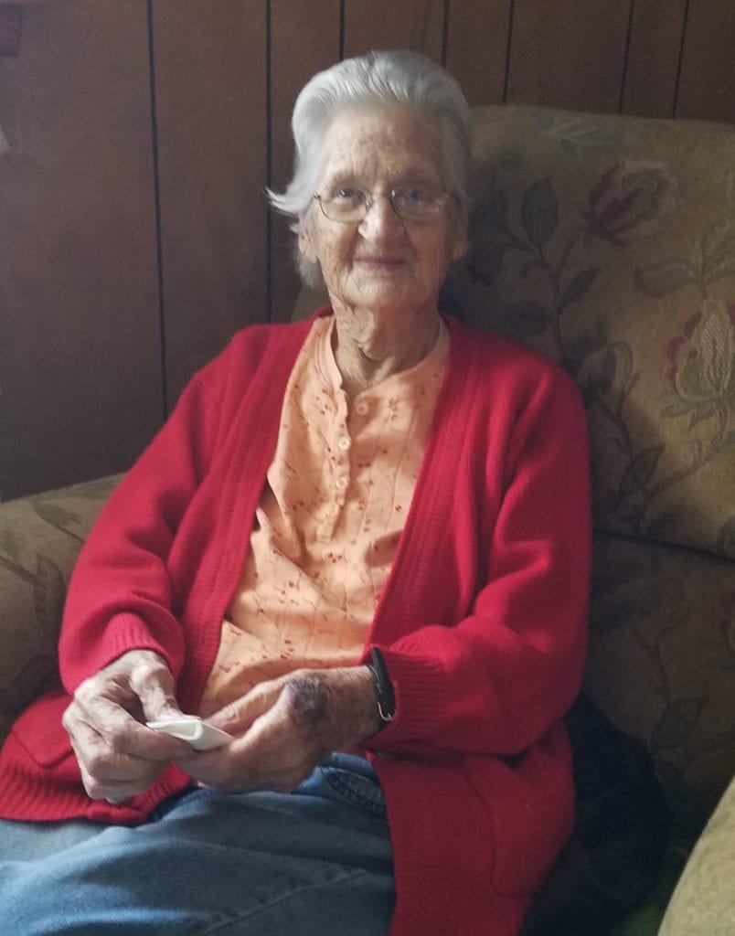 Margaret Brown sitting in chair at home