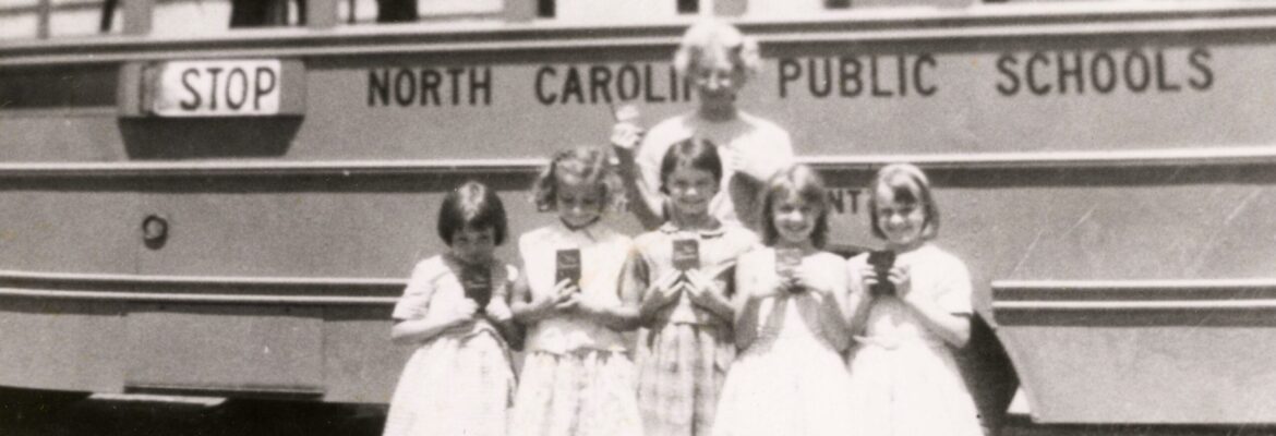 1964/65 Sandy Mush School - girls and teacher in front of school bus
